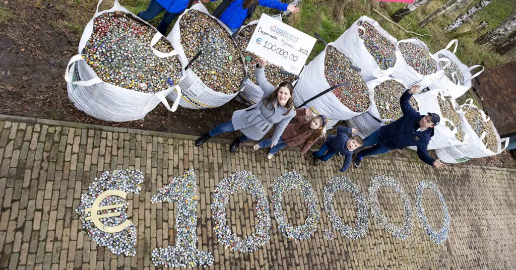 Dopjes in het getal 100.000 neergelegd door Nicolle en haar gezin